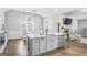 Open concept kitchen with large island, granite countertops, and stainless steel dishwasher at 92 Gordon Oaks Way, Moreland, GA 30259