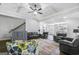 An expansive living room includes a fireplace, coffered ceiling, and stairs at 92 Gordon Oaks Way, Moreland, GA 30259