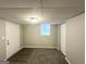 Finished basement area with gray carpet, white door, and a small window at 1889 Silver Creek Dr, Austell, GA 30168