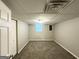 Basement featuring plush carpeting, neutral walls, and one bright window at 1889 Silver Creek Dr, Austell, GA 30168
