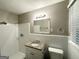 Bathroom featuring a shower, granite vanity, mirror, and tile flooring at 1889 Silver Creek Dr, Austell, GA 30168
