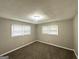 Bedroom featuring plush carpeting, neutral walls, and two bright windows at 1889 Silver Creek Dr, Austell, GA 30168