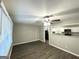 A well-lit living room featuring modern flooring and a view into the kitchen at 1889 Silver Creek Dr, Austell, GA 30168