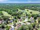 Aerial view of the community highlighting the lush landscaping and golf course at 121 Tamerlane, Peachtree City, GA 30269
