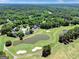 Aerial view of the community highlighting the lush landscaping and golf course at 121 Tamerlane, Peachtree City, GA 30269