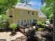 Secluded backyard featuring a wooden deck, mature trees and lush landscaping at 121 Tamerlane, Peachtree City, GA 30269