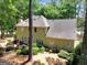 Backyard features a deck, mature trees and manicured landscaping at 121 Tamerlane, Peachtree City, GA 30269