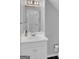 Bathroom featuring a white vanity with sink, framed mirror and toilet paper holder at 121 Tamerlane, Peachtree City, GA 30269