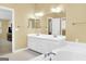 Bathroom with double sink vanity, large mirrors and a soaking tub at 121 Tamerlane, Peachtree City, GA 30269