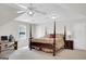 Spacious primary bedroom featuring a four poster bed and ceiling fan at 121 Tamerlane, Peachtree City, GA 30269