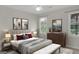 Comfortable bedroom with tasteful decor, featuring soft lighting, stylish furniture, and serene views at 121 Tamerlane, Peachtree City, GA 30269