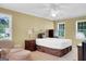 Well-lit bedroom featuring neutral walls, and chair near a window at 121 Tamerlane, Peachtree City, GA 30269