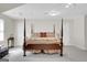 Bedroom with four poster bed, ceiling fan and two white doors at 121 Tamerlane, Peachtree City, GA 30269