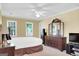 Spacious bedroom with large windows, ceiling fan and hardwood furniture at 121 Tamerlane, Peachtree City, GA 30269