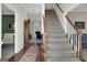 Traditional foyer features wooden floors, staircase and view of living spaces at 121 Tamerlane, Peachtree City, GA 30269