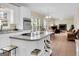 Bright kitchen with island cooktop, white cabinets, and a wine rack for storing your favorite beverages at 121 Tamerlane, Peachtree City, GA 30269