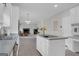 Kitchen open to living room with stainless appliances and island at 121 Tamerlane, Peachtree City, GA 30269