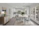 Eat-in kitchen featuring white cabinets, center island, and adjacent dining area at 121 Tamerlane, Peachtree City, GA 30269
