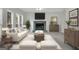 A living room featuring white furniture, decor and a fireplace with mantle at 121 Tamerlane, Peachtree City, GA 30269
