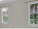 This room is brightened by two windows that provide natural light and views of the lush greenery outside at 121 Tamerlane, Peachtree City, GA 30269