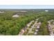 Aerial view shows a neighborhood with tree-lined streets and lush greenery at 126 Ardenlee Dr, Peachtree City, GA 30269