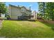 Expansive backyard featuring a tiered deck and patio, perfect for entertaining and enjoying outdoor living at 126 Ardenlee Dr, Peachtree City, GA 30269