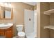 Cozy bathroom featuring a shower and a wooden vanity at 126 Ardenlee Dr, Peachtree City, GA 30269