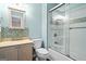 Bathroom featuring a shower with glass doors, mosaic tile accents, and a neutral vanity at 126 Ardenlee Dr, Peachtree City, GA 30269