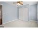 Bedroom featuring a neutral carpet, light blue walls, and a closet at 126 Ardenlee Dr, Peachtree City, GA 30269