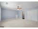 This large bedroom boasts a double closet and neutral carpet at 126 Ardenlee Dr, Peachtree City, GA 30269