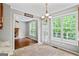 Bright breakfast nook with beautiful windows and a chandelier light fixture at 126 Ardenlee Dr, Peachtree City, GA 30269