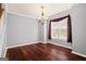 Formal dining room with hardwood floors, crown molding, and elegant chandelier at 126 Ardenlee Dr, Peachtree City, GA 30269