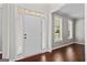 Inviting entryway with hardwood floors, neutral walls, and ample natural light at 126 Ardenlee Dr, Peachtree City, GA 30269
