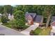 Charming two-story red brick home with a well-manicured front yard and mature trees at 126 Ardenlee Dr, Peachtree City, GA 30269