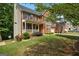 Traditional two-story brick home with a welcoming front porch and well-maintained landscaping at 126 Ardenlee Dr, Peachtree City, GA 30269