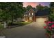 A charming two-story brick home with a well-manicured lawn and inviting front porch at 126 Ardenlee Dr, Peachtree City, GA 30269