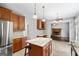 Spacious kitchen with a large island and stainless steel appliances overlooking the living room at 126 Ardenlee Dr, Peachtree City, GA 30269