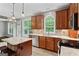 Open kitchen layout with granite countertops, stainless appliances, and breakfast bar seating at 126 Ardenlee Dr, Peachtree City, GA 30269