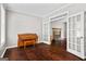 Versatile living room with hardwood floors, French doors, and a cozy fireplace at 126 Ardenlee Dr, Peachtree City, GA 30269