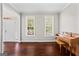 Bright living room with hardwood floors, natural light, and a classic piano at 126 Ardenlee Dr, Peachtree City, GA 30269