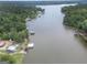 Aerial view of the lake house with dock, and large lake at 22 Waters Bridge Cir, Covington, GA 30014