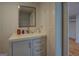 Bright bathroom with white vanity and hardwood floors at 22 Waters Bridge Cir, Covington, GA 30014