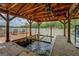 Covered boat dock featuring a boat lift, providing protection and convenience for watercraft storage and lake access at 22 Waters Bridge Cir, Covington, GA 30014