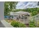 Inviting covered porch offering an ideal spot for outdoor relaxation with peaceful lake and backyard views at 22 Waters Bridge Cir, Covington, GA 30014