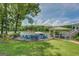 A lakeside backyard offers a fire pit, covered porch and lake access for tranquil outdoor living at 22 Waters Bridge Cir, Covington, GA 30014