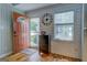 Bright foyer with hardwood floors, white shiplap walls, and rustic accents at 22 Waters Bridge Cir, Covington, GA 30014
