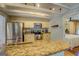 Bright kitchen with granite countertops, stainless appliances, and easy access to dining and bedroom areas at 22 Waters Bridge Cir, Covington, GA 30014