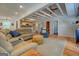 Open-concept living space with a modern kitchen, cozy seating, and rustic details at 22 Waters Bridge Cir, Covington, GA 30014