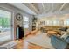 Cozy living room with white shiplap walls, a fireplace, and comfortable seating at 22 Waters Bridge Cir, Covington, GA 30014