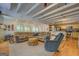 Spacious living room flowing into kitchen with shiplap, modern lighting, and cozy furnishings at 22 Waters Bridge Cir, Covington, GA 30014